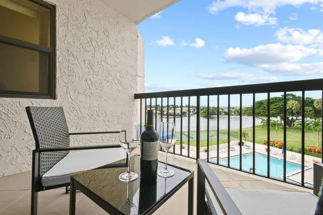 a view of a balcony with mountain view and wooden floor