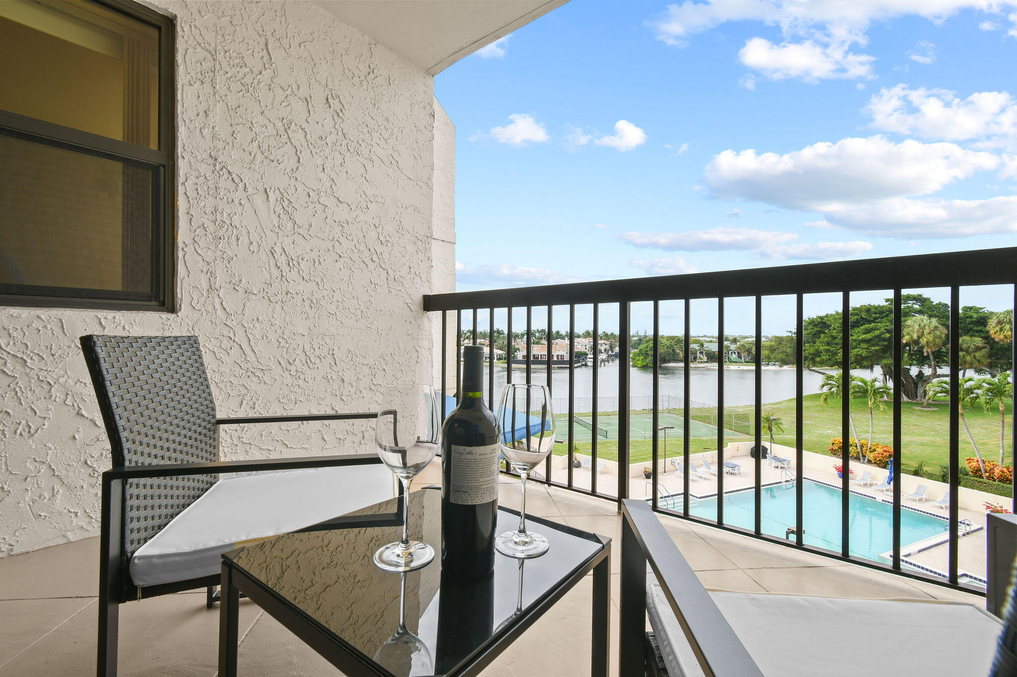364 Golfview Road, Unit 506 North Palm Beach, FL 33408 - Photo 9 of 44 a view of a balcony with mountain view and wooden floor