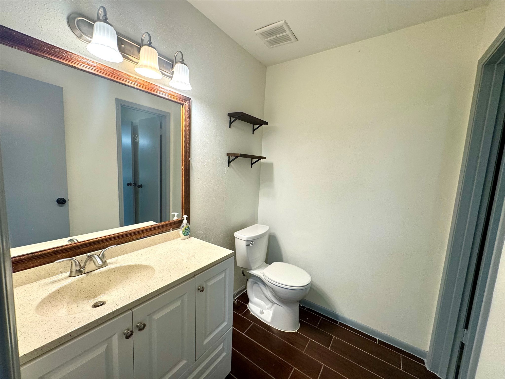 10010 Knoboak Drive, Unit 32 Houston, TX 77080 - Photo 15 of 17 a bathroom with a sink and a mirror