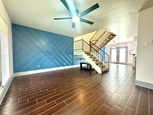a view of entryway and hall with wooden floor