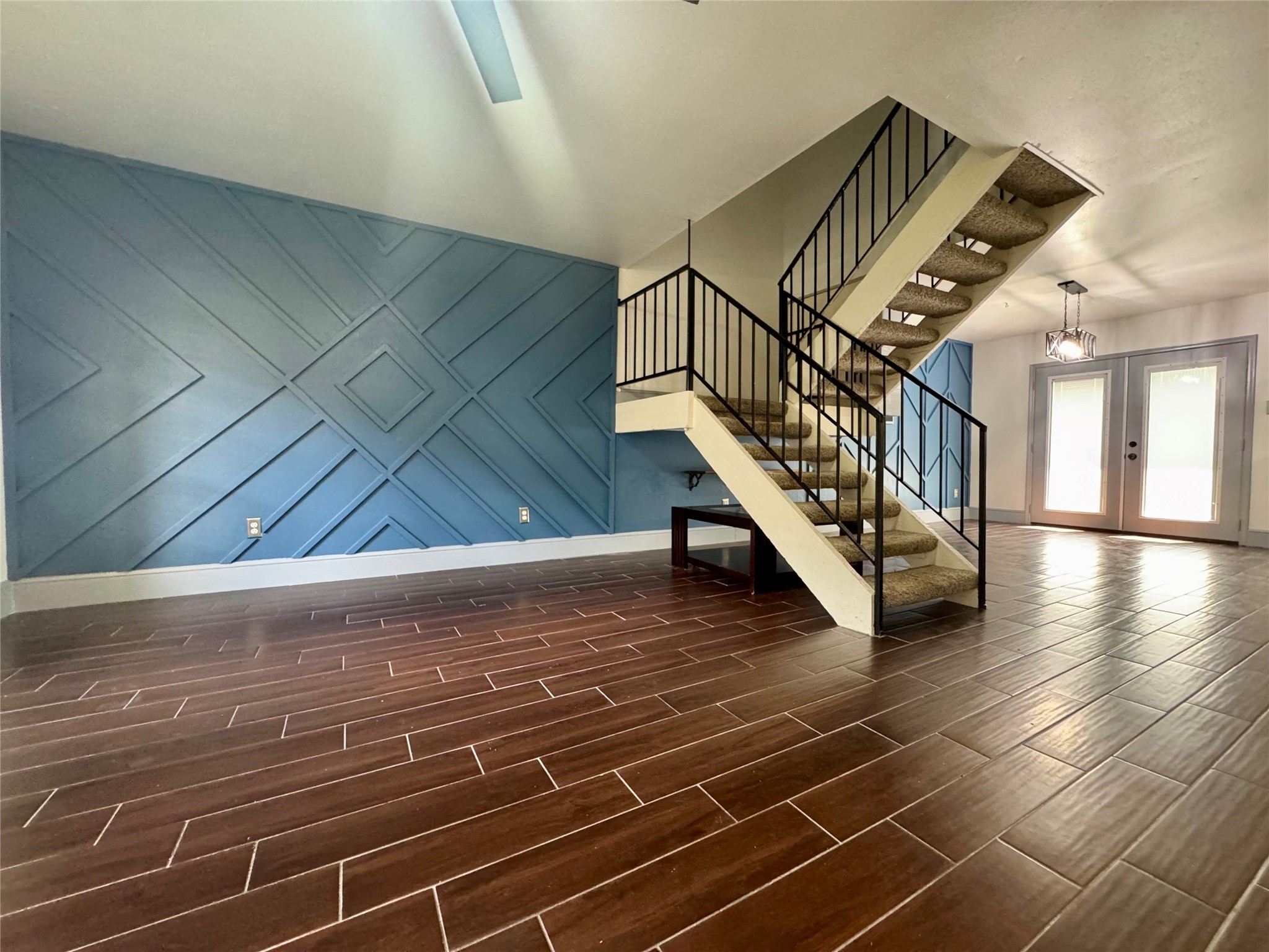 10010 Knoboak Drive, Unit 32 Houston, TX 77080 - Photo 9 of 17 a view of entryway and hall with wooden floor