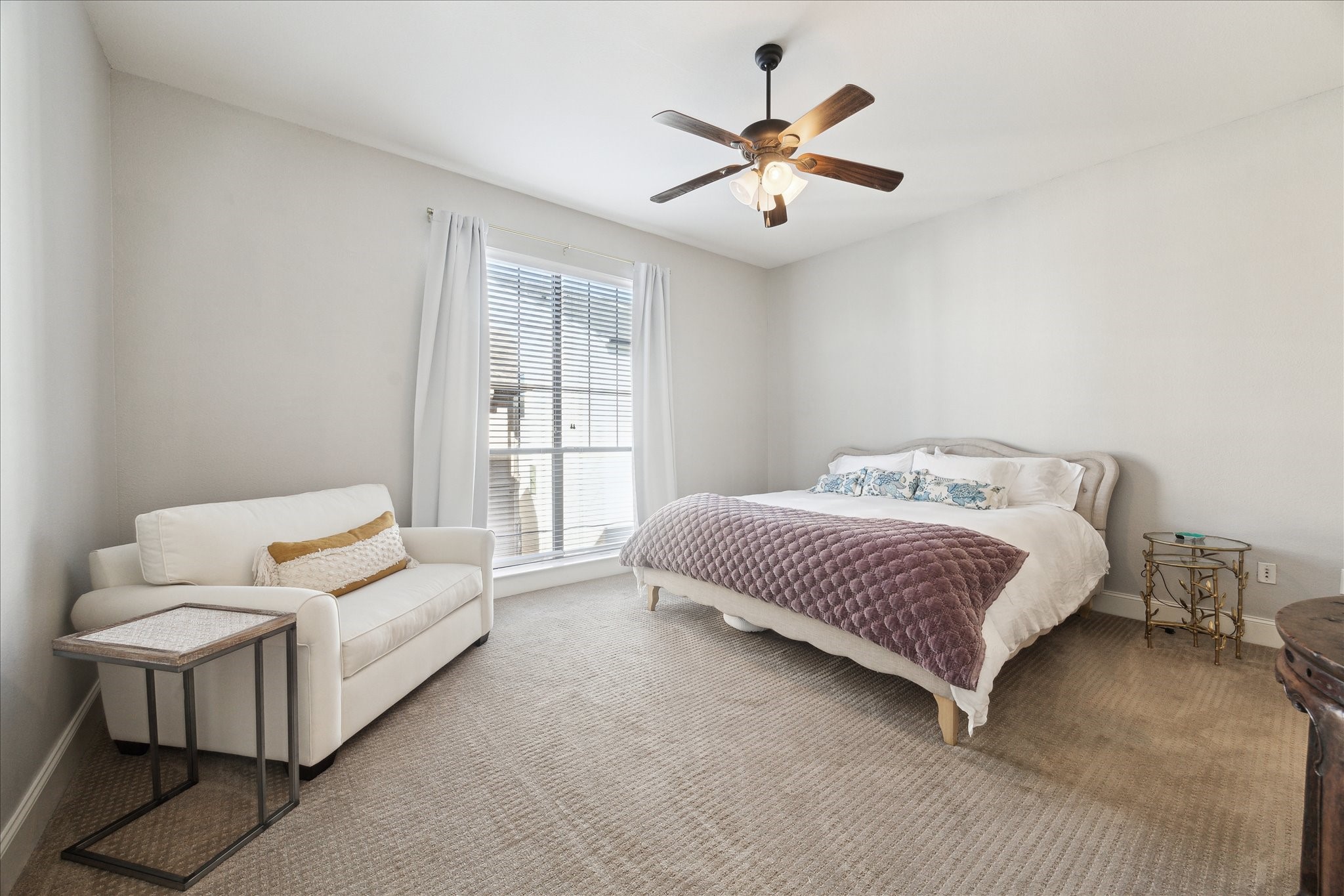 2120 Kipling Street, Unit 304 Houston, TX 77098 - Photo 11 of 21 a spacious bedroom with a bed and a couch