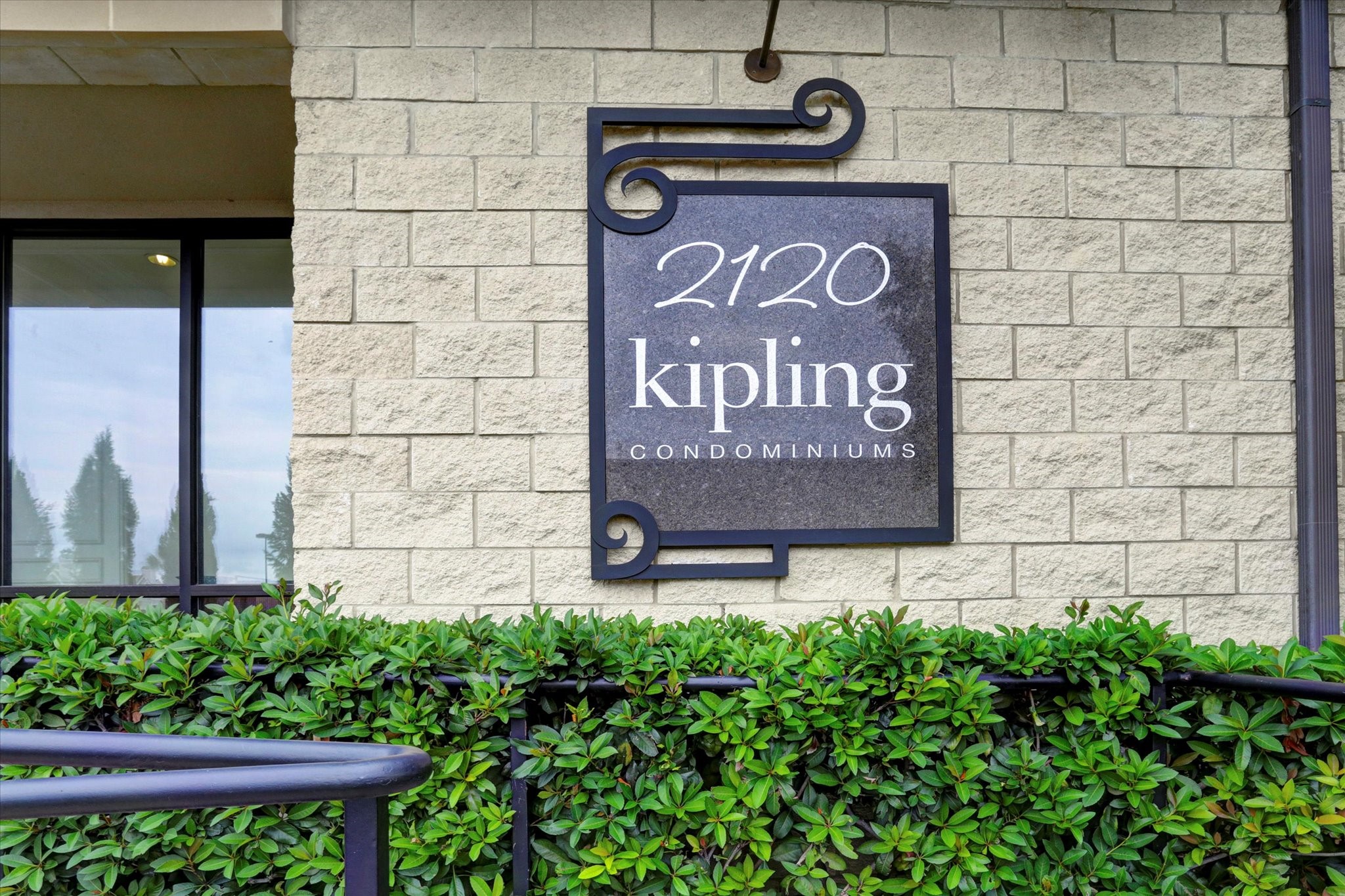 2120 Kipling Street, Unit 304 Houston, TX 77098 - Photo 2 of 21 a sign on the wall next to a building