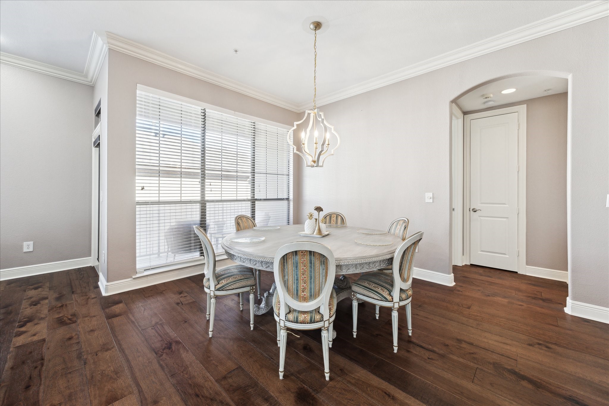 2120 Kipling Street, Unit 304 Houston, TX 77098 - Photo 9 of 21 a view of a dining room with furniture window and wooden floor