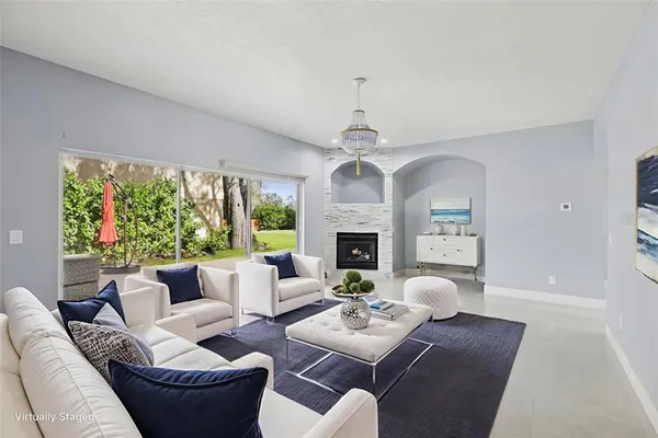 a view of a house with backyard and a tree