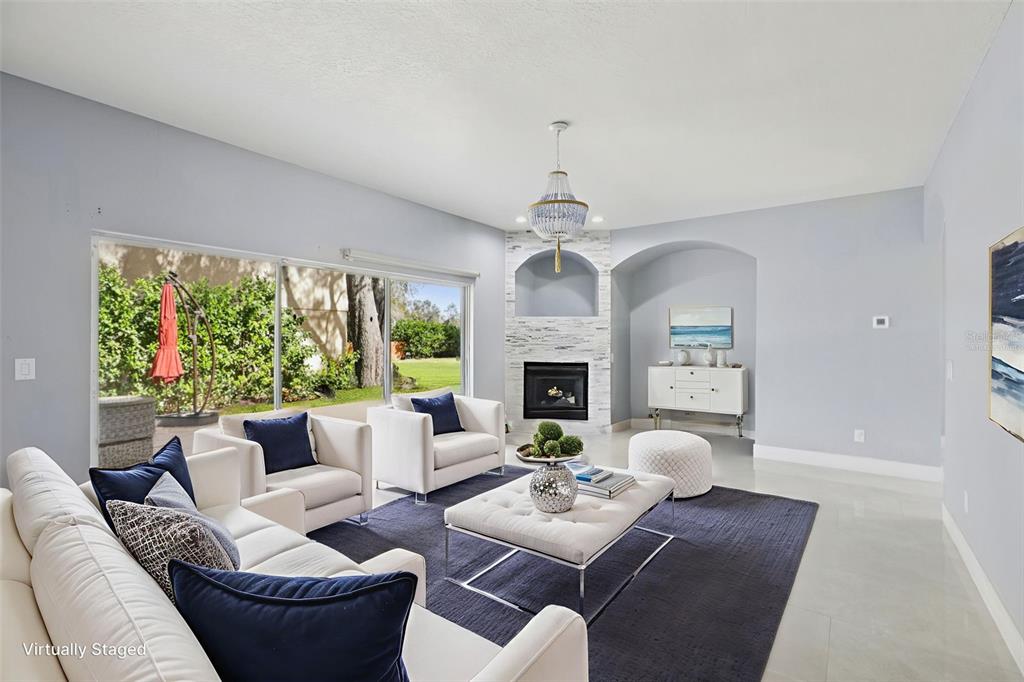 1978 Applegate Drive Ocoee, FL 34761 - Photo 12 of 50 a living room with furniture a fireplace and a large window