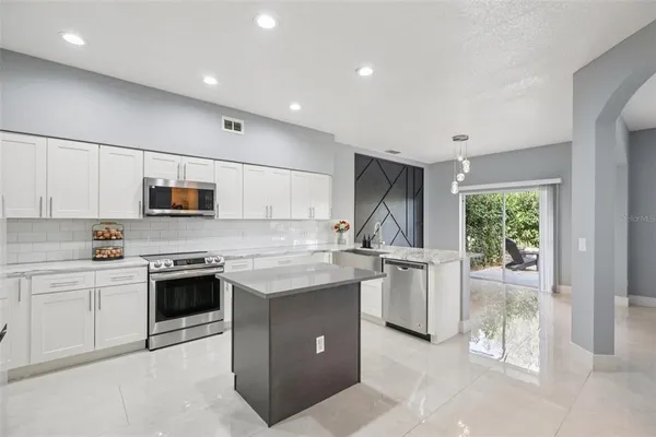 a view of swimming pool with outdoor seating and city view