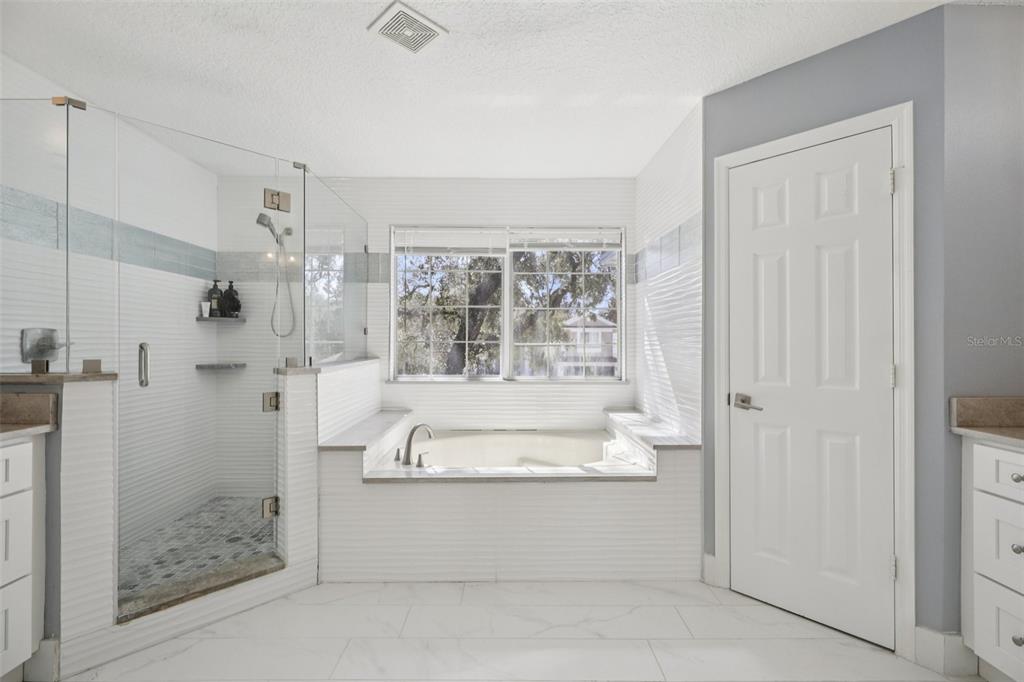 1978 Applegate Drive Ocoee, FL 34761 - Photo 27 of 50 a bathroom with a tub shower and view of bathroom