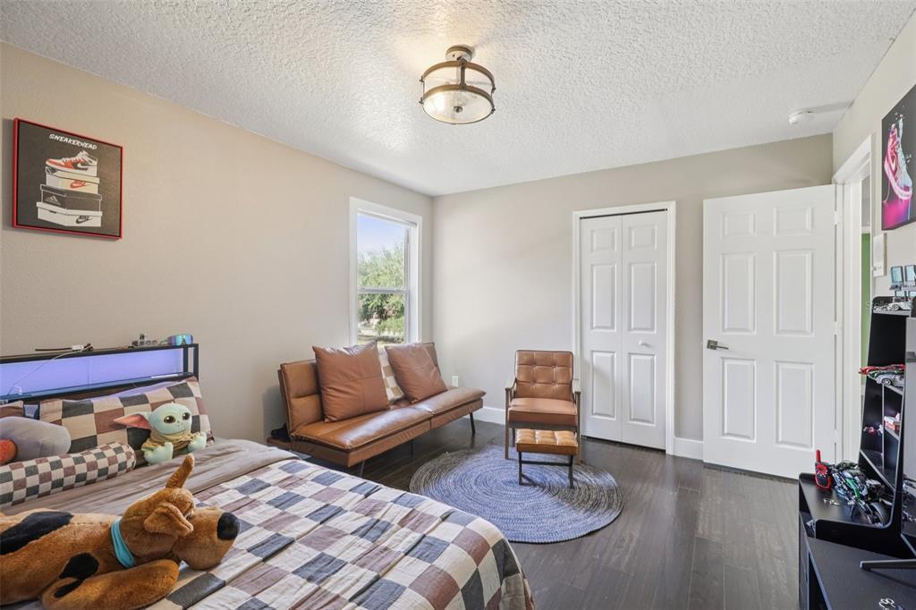 1978 Applegate Drive Ocoee, FL 34761 - Photo 34 of 50 a bedroom with two beds and a couch