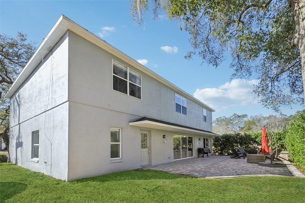 1978 Applegate Drive Ocoee, FL 34761 - Photo 40 of 50 a view of a house with backyard and a tree