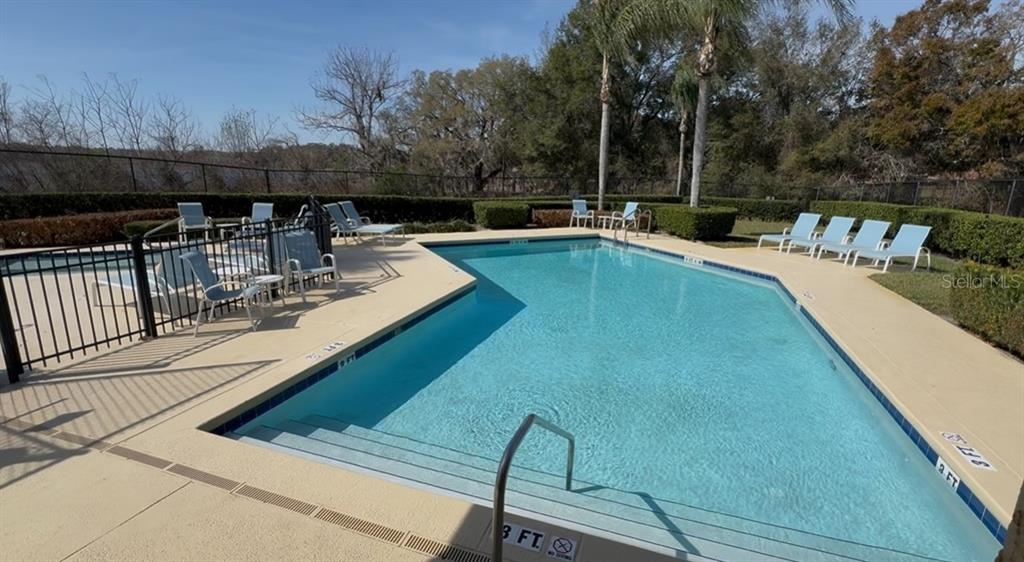 1978 Applegate Drive Ocoee, FL 34761 - Photo 47 of 50 a view of a swimming pool with a patio and a backyard
