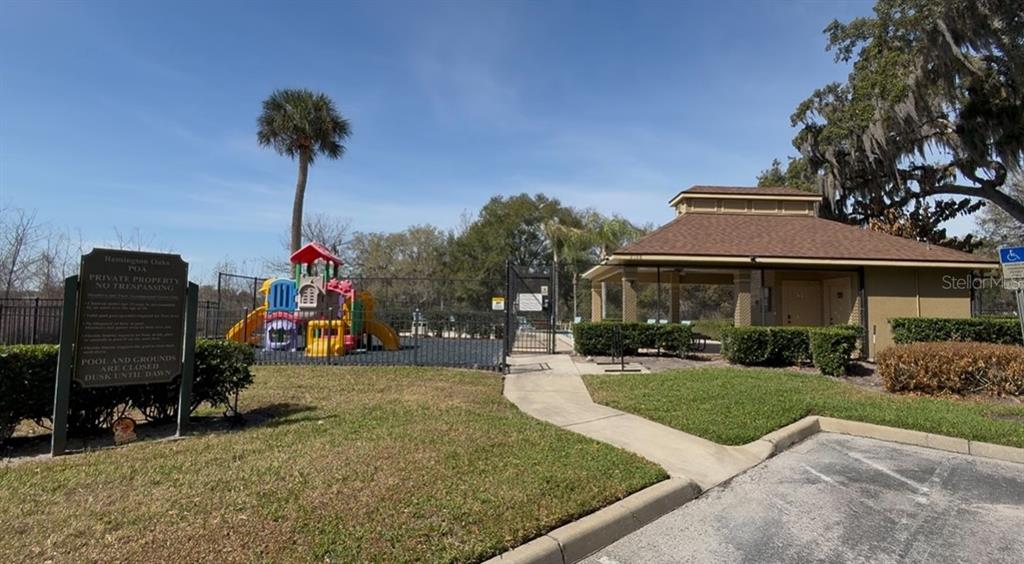 1978 Applegate Drive Ocoee, FL 34761 - Photo 48 of 50 a front view of a house with a yard and potted plants