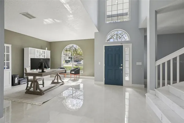 a bedroom with a large bed and a dresser