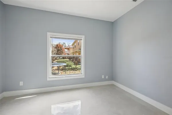 a bathroom with a granite countertop sink a toilet a mirror and shower