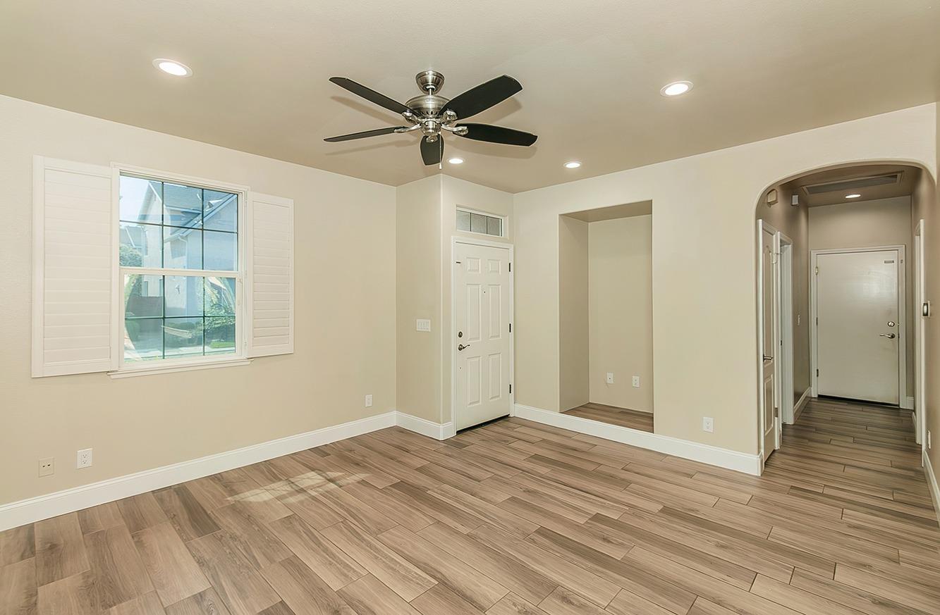 735 West Brittany Lane Clovis, CA 93619 - Photo 3 of 30 a view of a livingroom with a ceiling fan and window