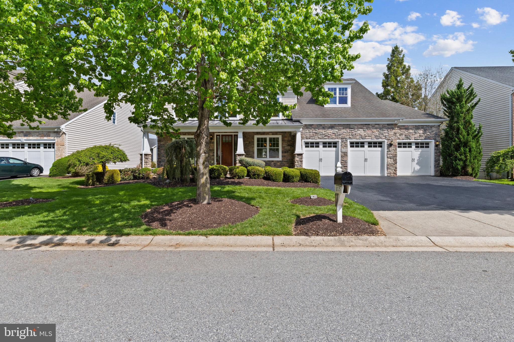 10725 Taylor Farm Road Woodstock, MD 21163 - Photo 1 of 70 a front view of a house with a yard and potted plants
