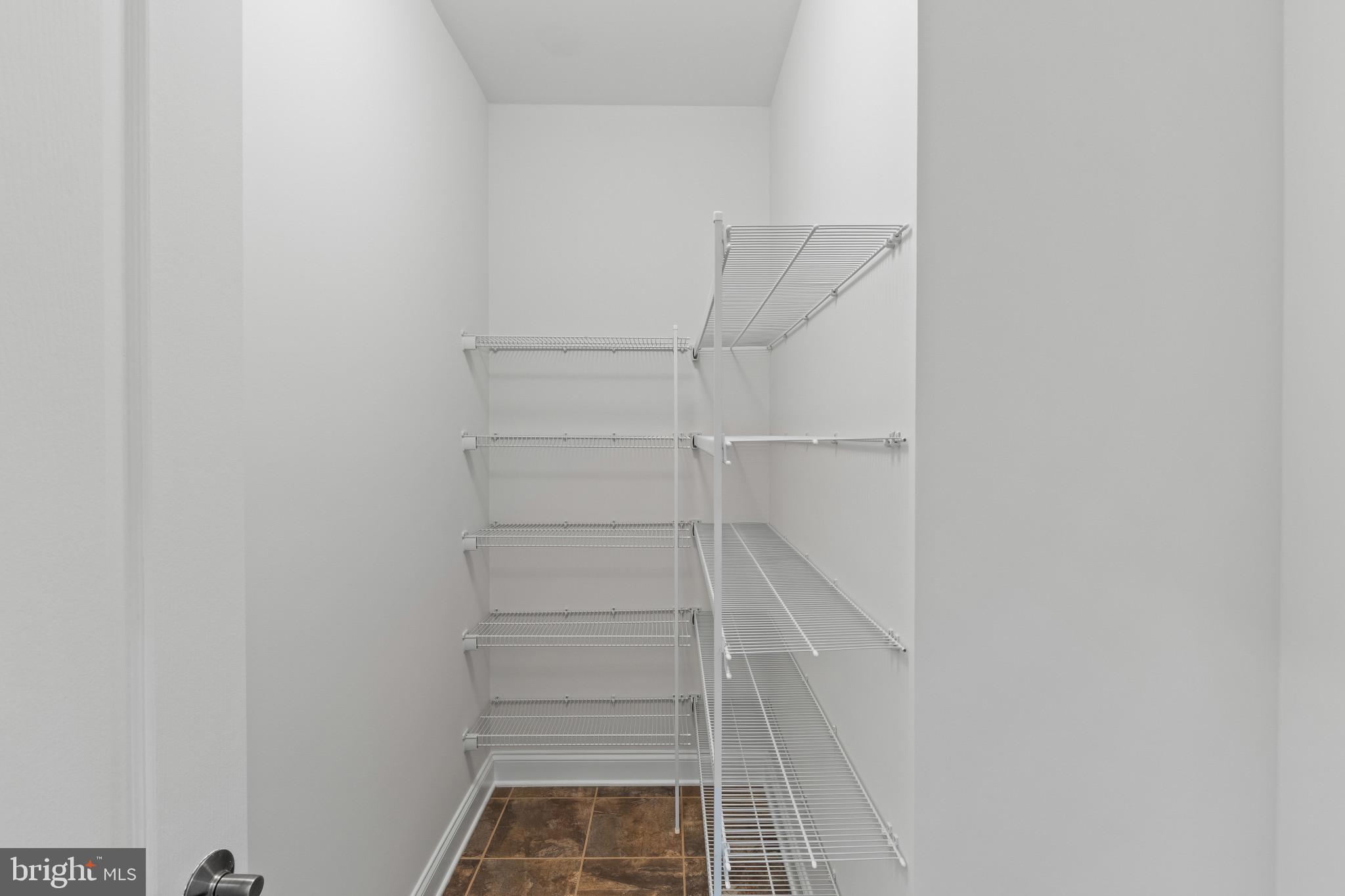 10725 Taylor Farm Road Woodstock, MD 21163 - Photo 21 of 70 a view of staircase with white walls and white door