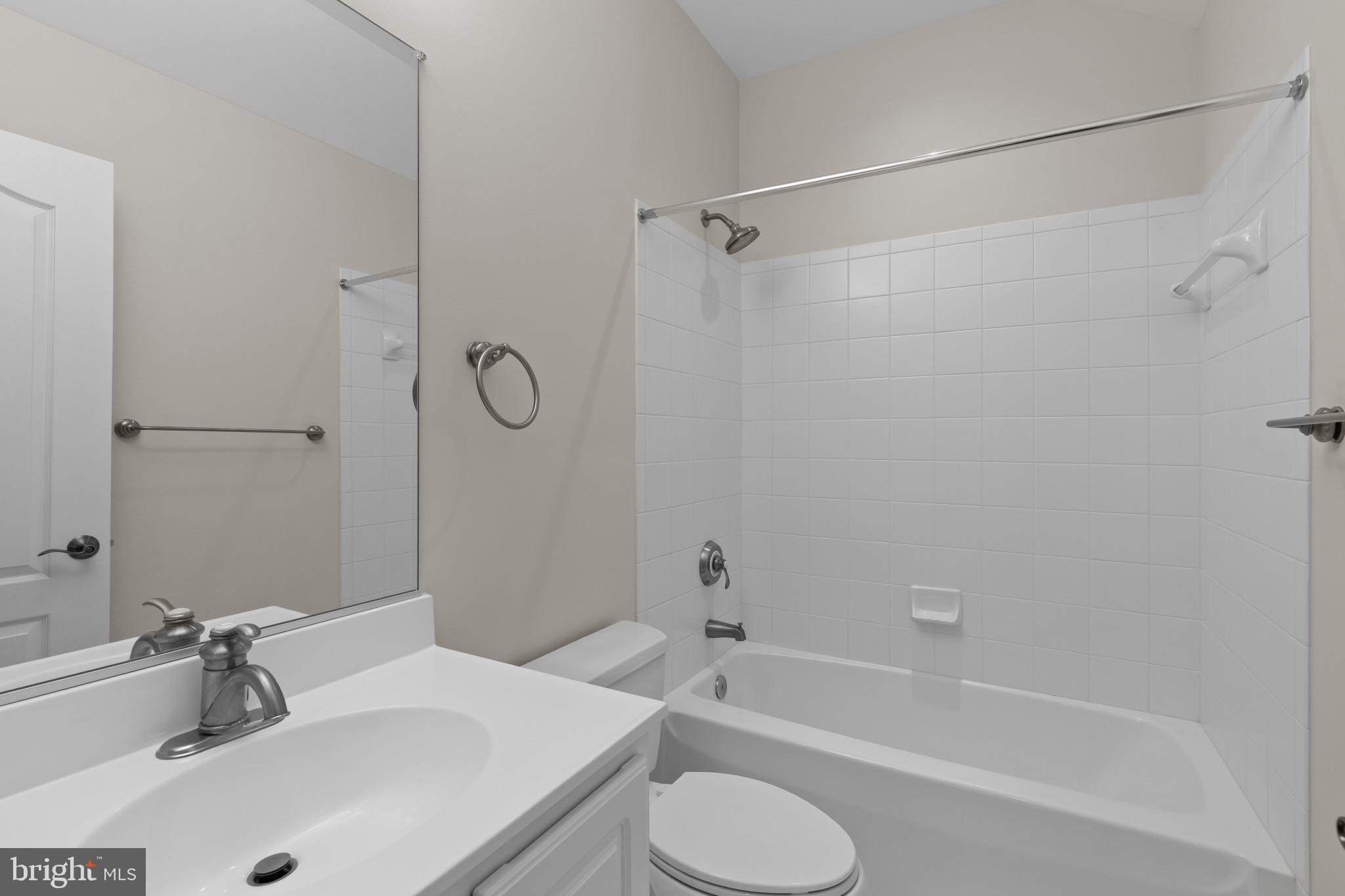 10725 Taylor Farm Road Woodstock, MD 21163 - Photo 43 of 70 a bathroom with a sink toilet and shower