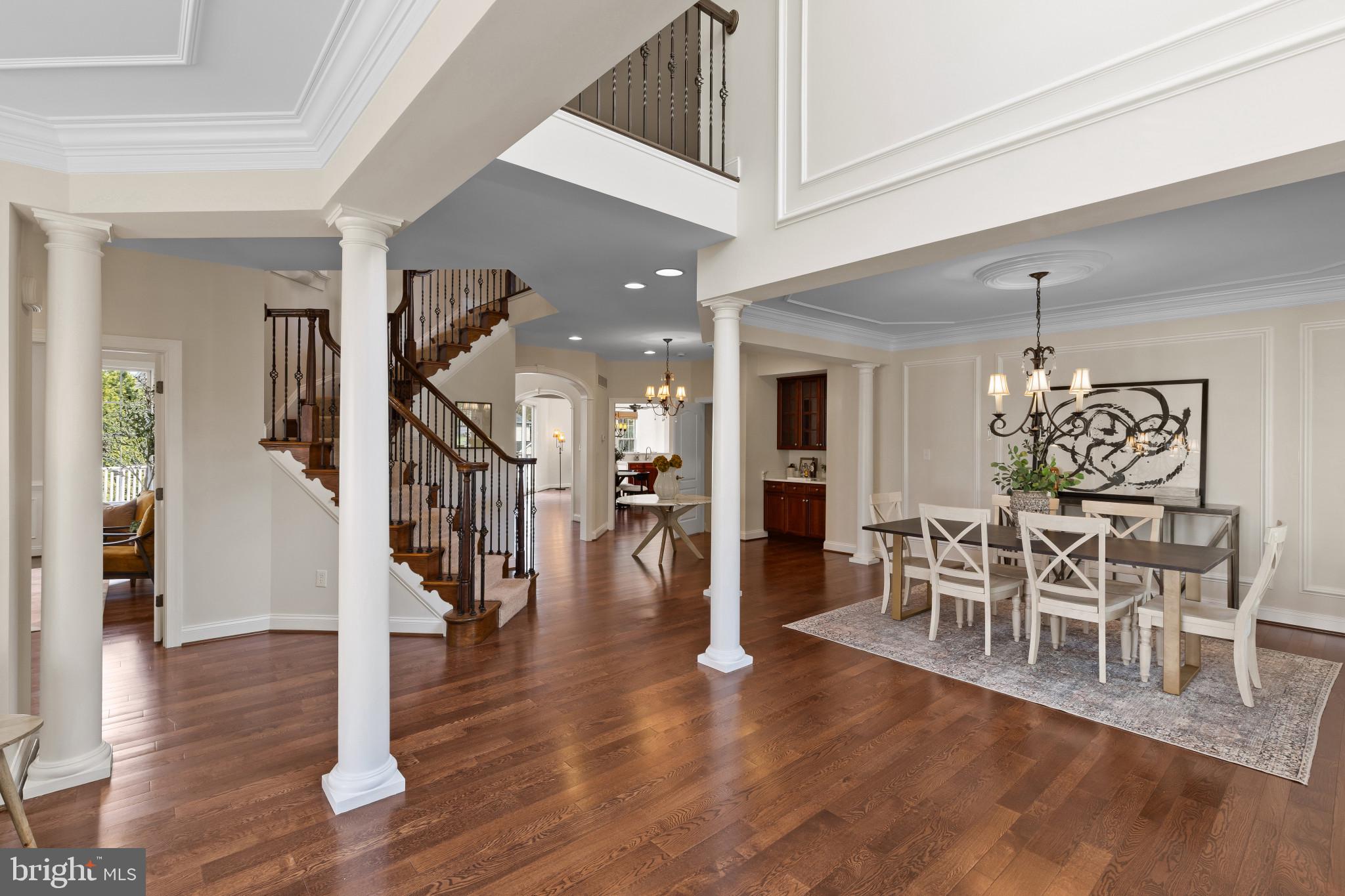 10725 Taylor Farm Road Woodstock, MD 21163 - Photo 6 of 70 a view of a dining room with furniture and wooden floor