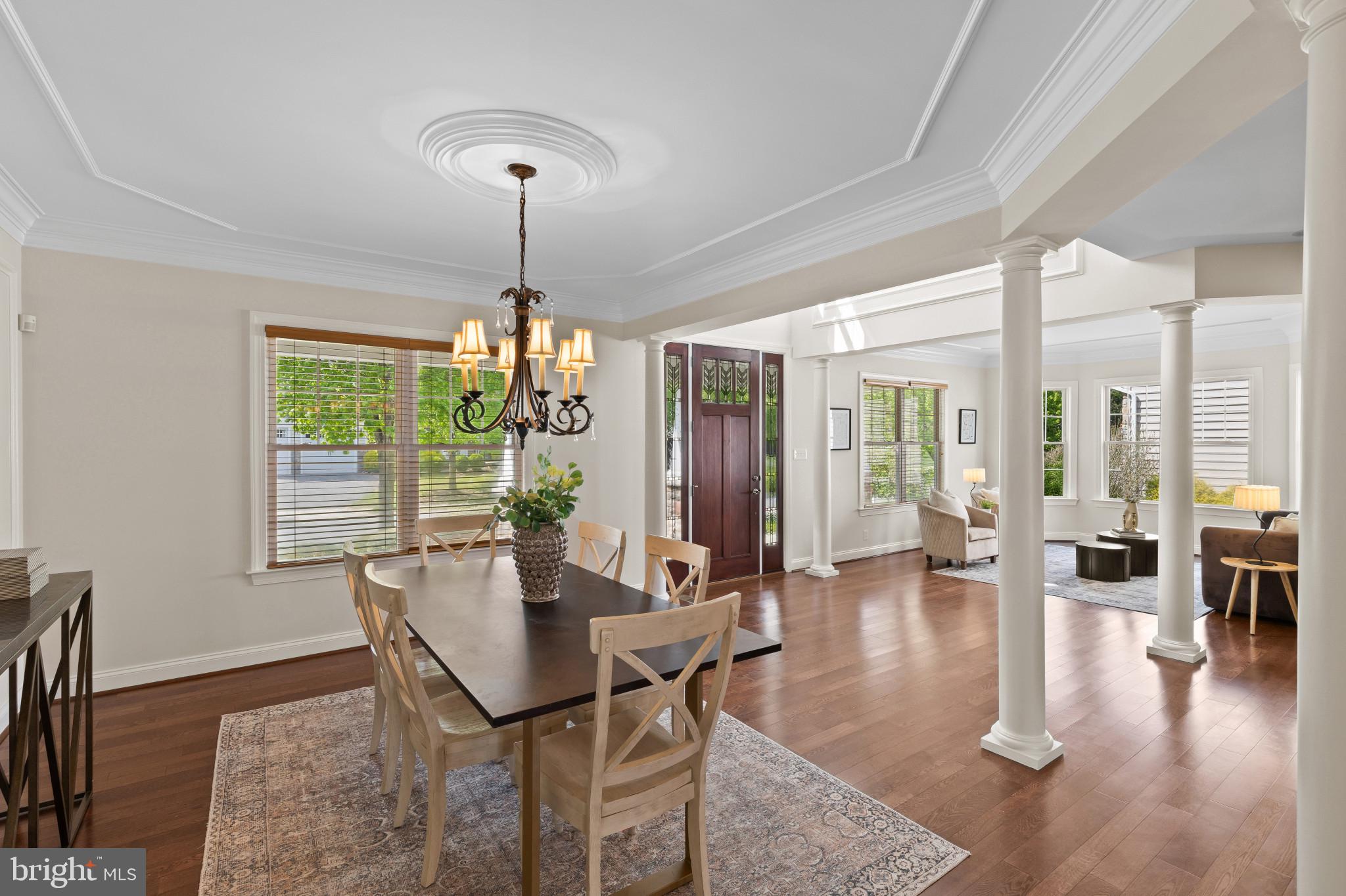 10725 Taylor Farm Road Woodstock, MD 21163 - Photo 7 of 70 a dining room with furniture wooden floor a chandelier