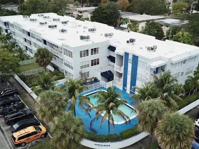 a view of a swimming pool with a yard