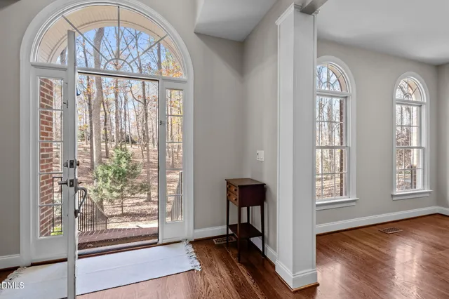 a view of entryway with wooden floor and door