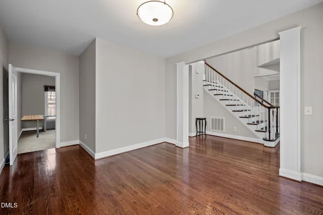 a spacious bedroom with a bed and a fireplace