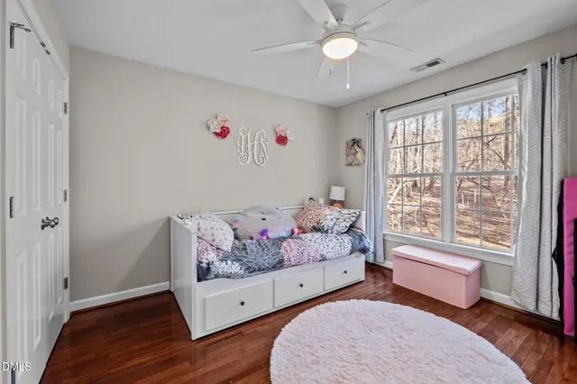a bathroom with a toilet and a shower curtain