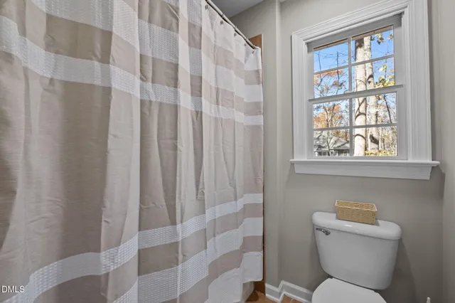 a view of a wooden fence and a backyard of the house