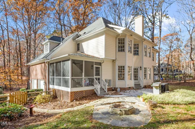 a view of a yard with large trees