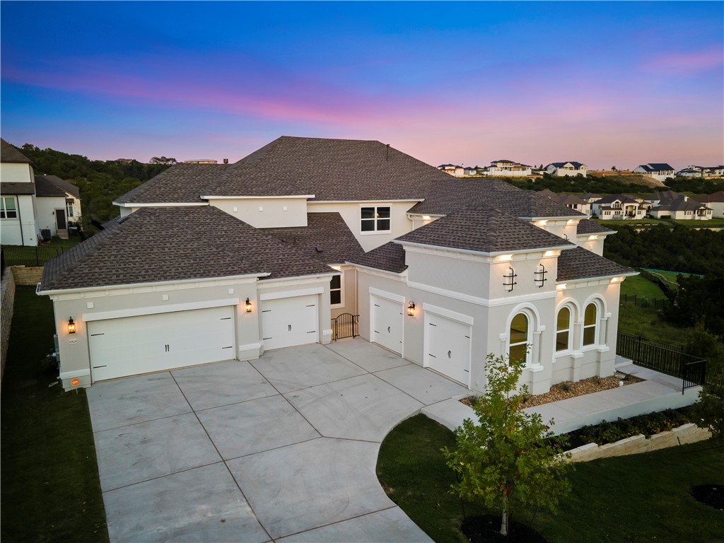 a aerial view of a house with a yard