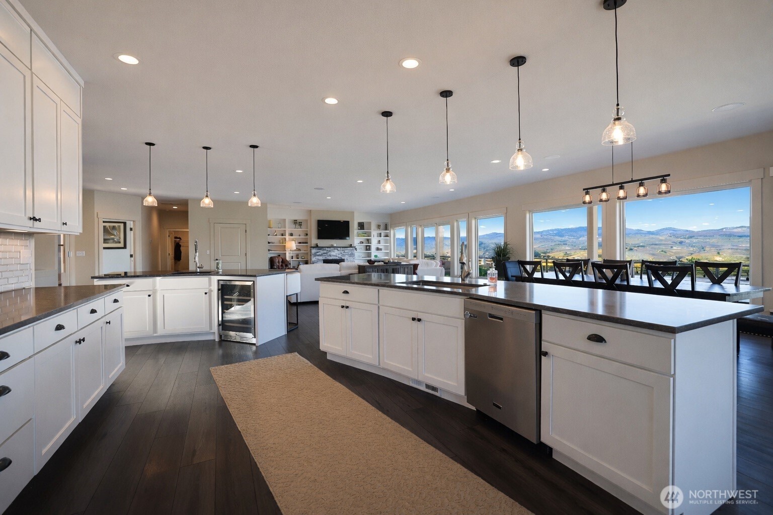 149 Clos Chevalle Road Chelan, WA 98816 - Photo 12 of 37 a large white kitchen with lots of counter space wooden floor and appliances