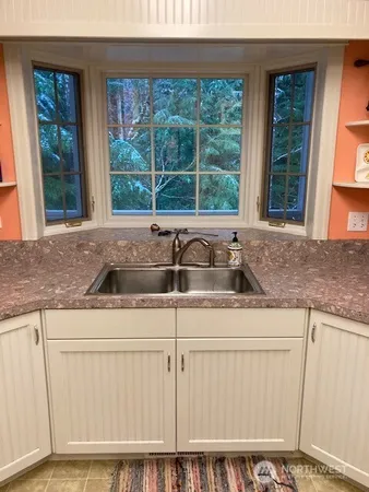 a stove top oven sitting inside of a kitchen