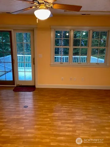 a view of balcony with deck and yard