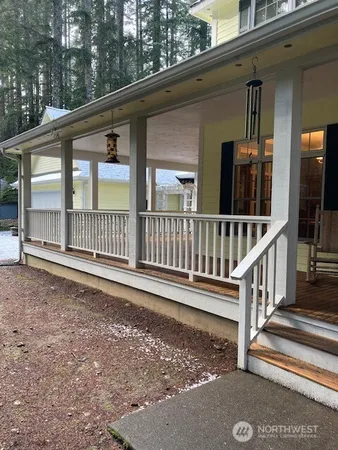 a view of porch with a small yard