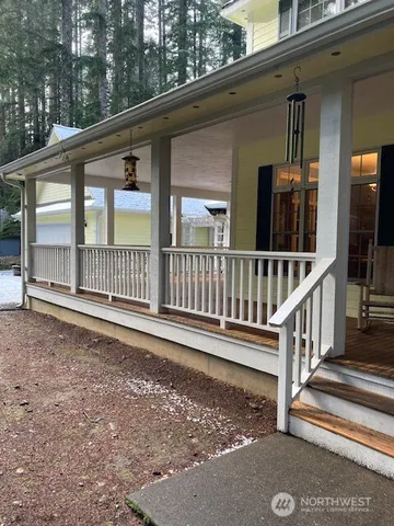 a view of porch with a small yard