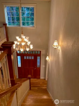 a view of hall way with furniture