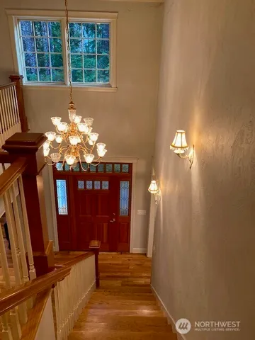 a view of hall way with furniture