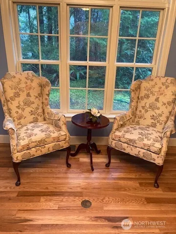 a living room with furniture and a window