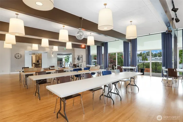 a large kitchen with a table and chairs