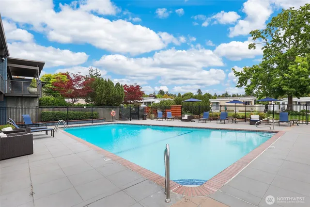 a view of a swimming pool and a chairs