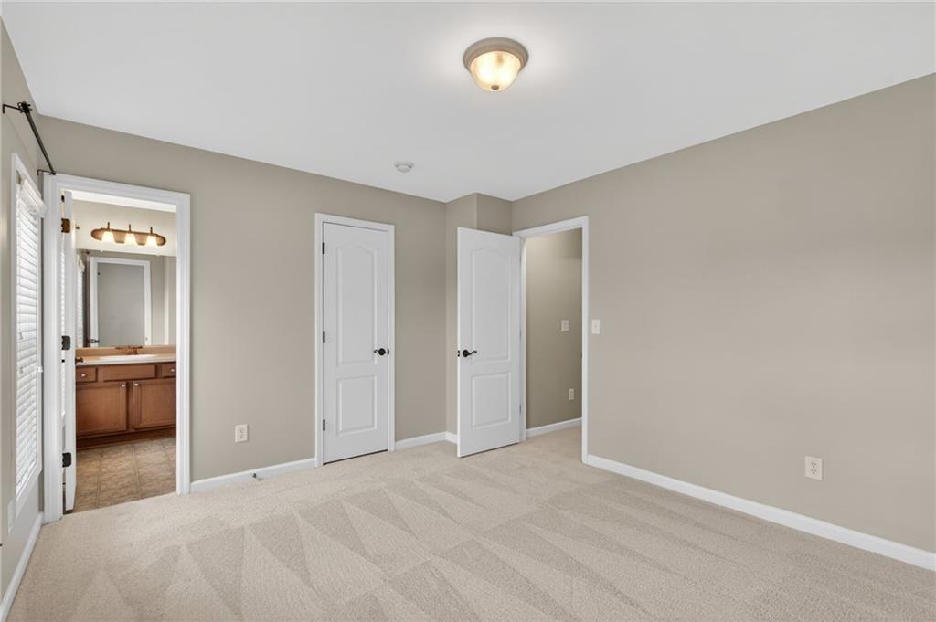 1186 Lake Point Way Suwanee, GA 30024 - Photo 28 of 35 a view of an empty room