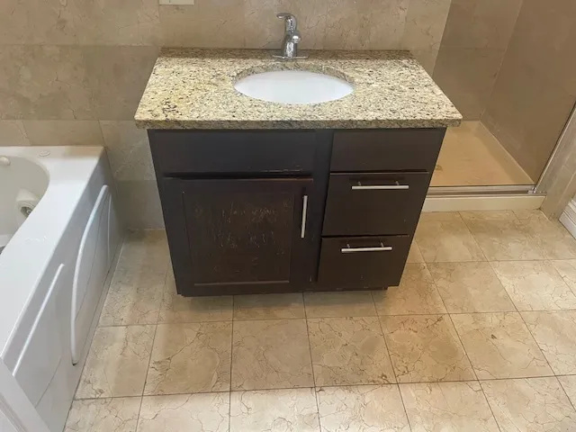 a bathroom with a toilet and a rug