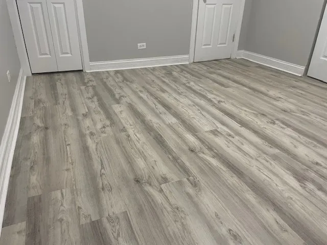 a white toilet sitting next to a white sink