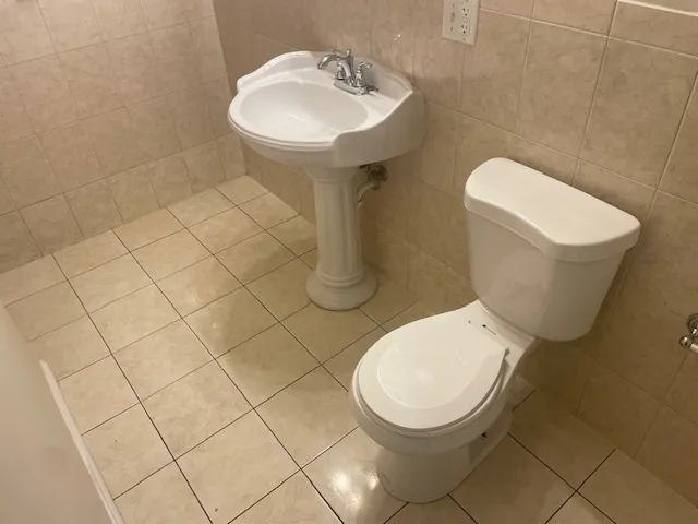 a view of water heater room with stairs