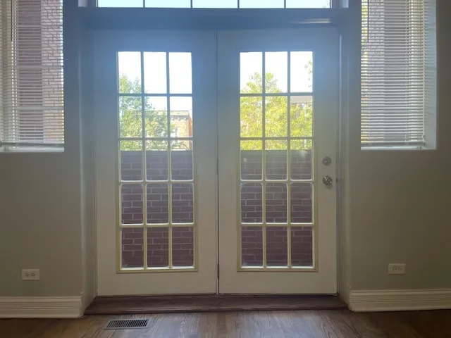 a view of empty room with windows
