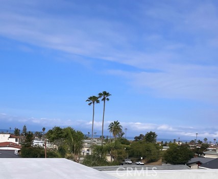 145 West Canada San Clemente, CA 92672 - Photo 4 of 7 a view of a garden with a building in the background