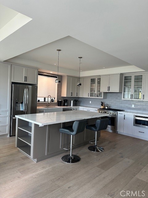 145 West Canada San Clemente, CA 92672 - Photo 6 of 7 a kitchen with stainless steel appliances granite countertop a lot of counter space and wooden floor