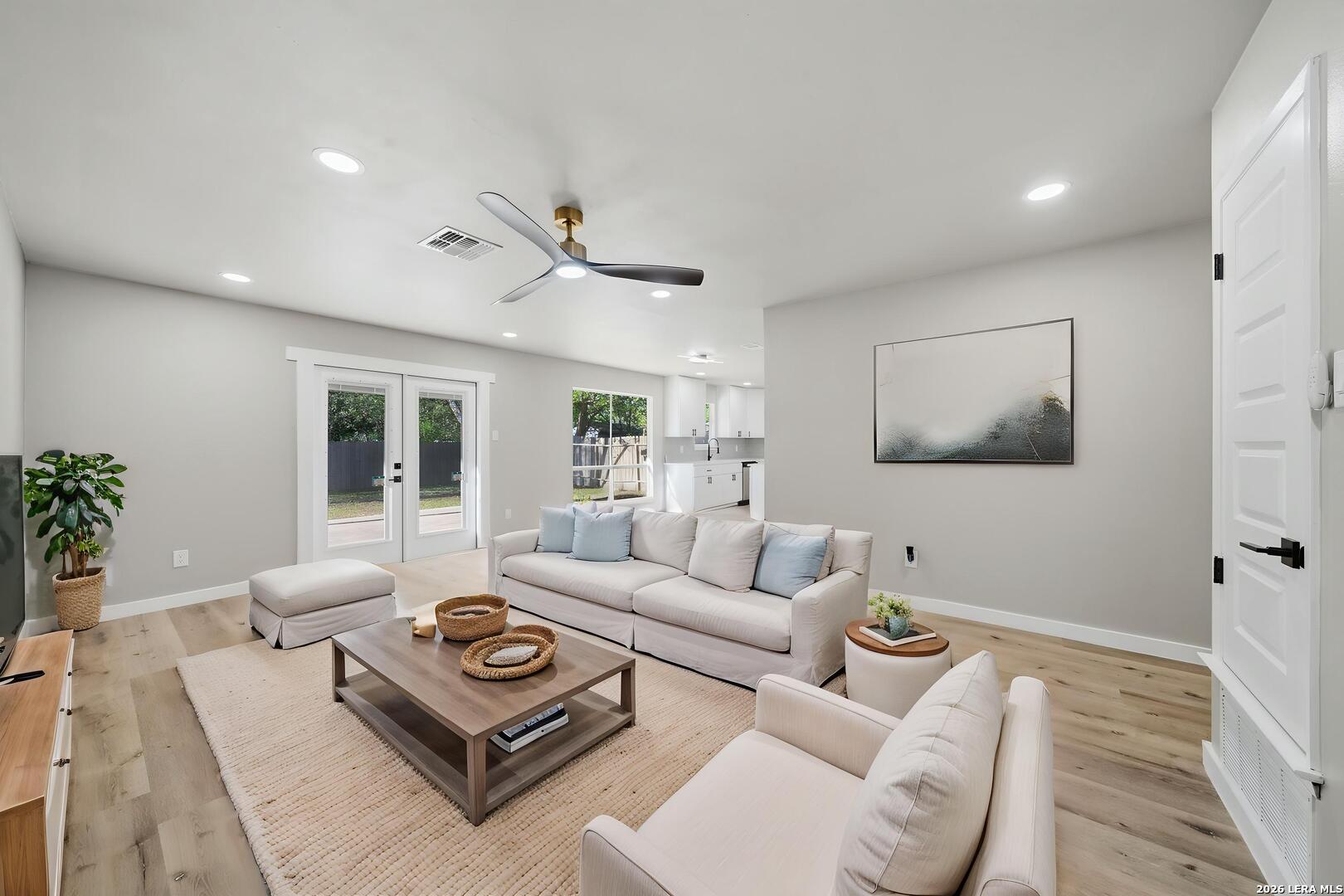 9446 Cliff Way Street San Antonio, TX 78250 - Photo 5 of 24 a living room with furniture and a large window