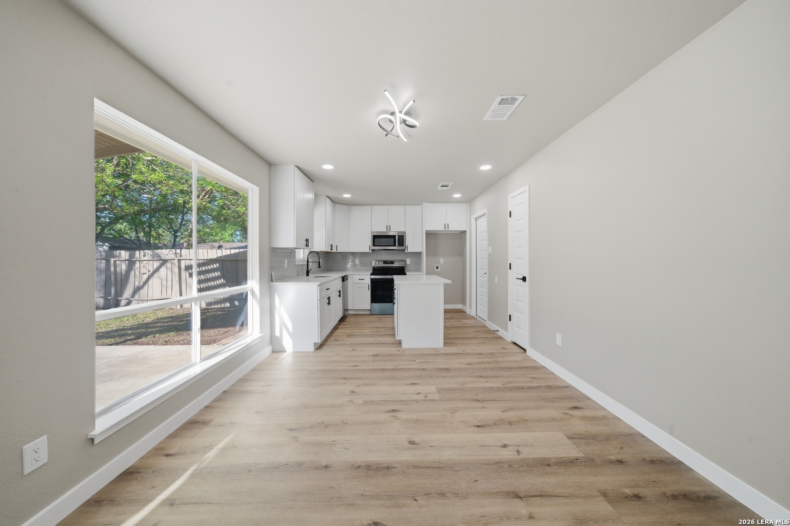9446 Cliff Way Street San Antonio, TX 78250 - Photo 7 of 24 a view of kitchen with furniture and window